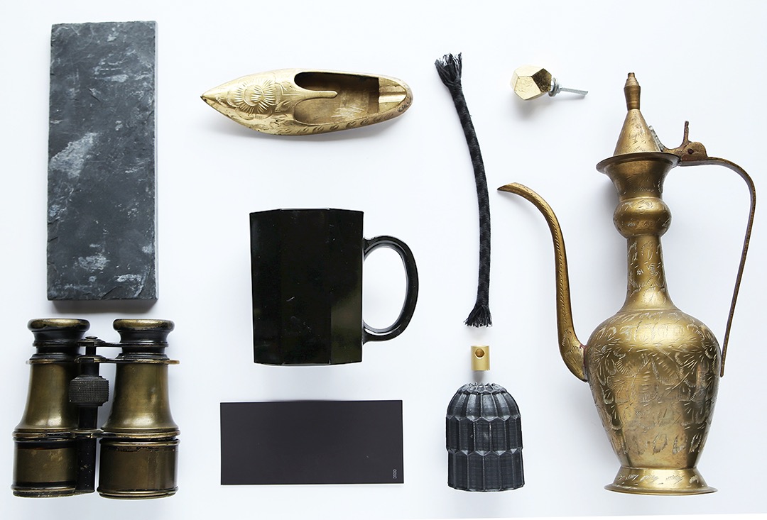Moodboard with black and brass decor